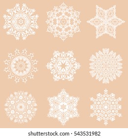 9 vector snowflakes and christmas winter set. Digital hand drawn of element in the clean, whimsical and modern surface on a beige background.