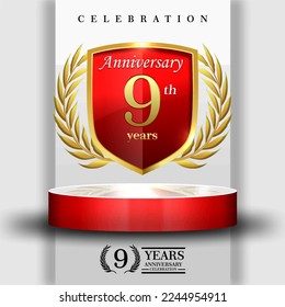 9 years gold anniversary celebration logo with 3d red cylinder podium , isolated on grey background