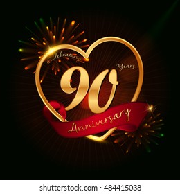 90 years anniversary logo golden colored,with love shape, red ribbon, and fireworks background