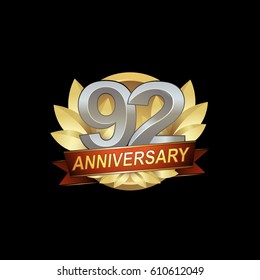 92nd Anniversary logo with golden wreath, silver number, red ribbon, black background