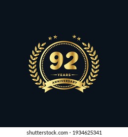 92th golden anniversary logo, with shiny ring and golden ribbon, laurel wreath isolated on navy blue background