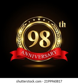 98th golden anniversary logo, with shiny ring and red ribbon, isolated on black background, vector design
