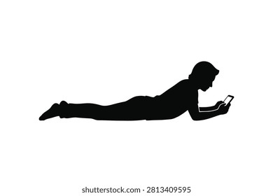 ['A solid black silhouette of a person lying prone on the ground while holding and looking at a mobile phone']