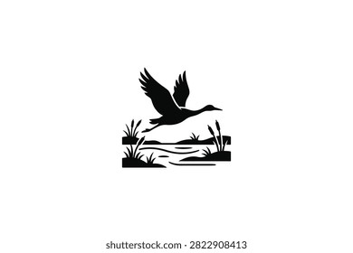 ['A stylized black graphic illustration featuring a bird with wings spread wide, flying above a small body of water surrounded by reeds and aquatic plants']