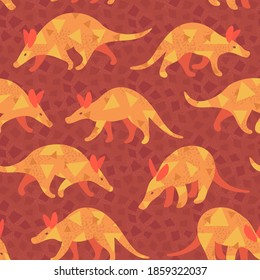 Patrón sin fisuras de Aardvark. Maravilloso animal africano. Encantadoras criaturas divertidas de fondo ornamental. Mamíferos estilizados con un patrón geométrico. Colores cálidos. Paleta amarilla y naranja. Diseño de ropa.