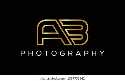 AB Artistic Brush Letter Logo Handwritten in Golden Colors Vector Illustration. Suitable for business, consulting group company.