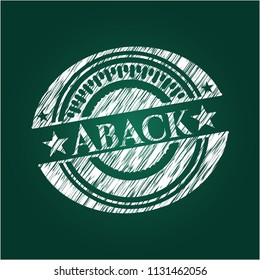 Aback chalk emblem written on a blackboard
