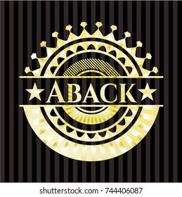 Aback gold badge or emblem