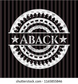 Aback silvery emblem or badge