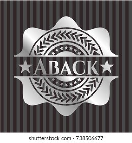 Aback silvery emblem or badge