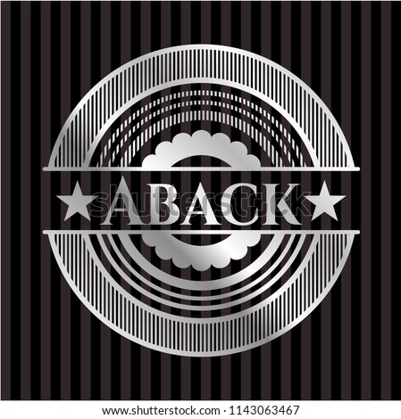 Aback silvery emblem or badge