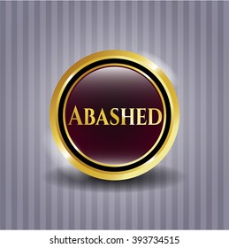 Abashed golden emblem or badge