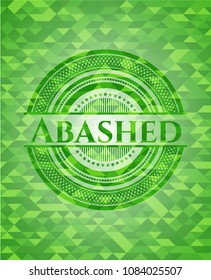 Abashed green emblem. Mosaic background