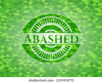 Abashed green emblem. Mosaic background