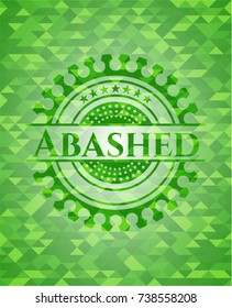 Abashed green emblem with triangle mosaic background