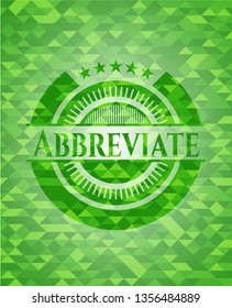 Abbreviate green emblem with triangle mosaic background