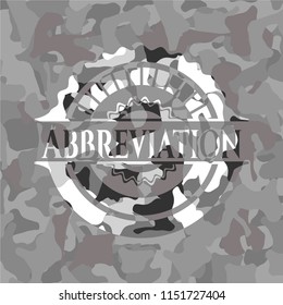 Abbreviation on grey camouflaged pattern