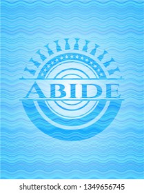 Abide light blue water style emblem.