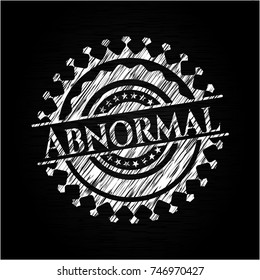 Abnormal chalk emblem written on a blackboard