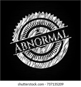 Abnormal chalkboard emblem on black board