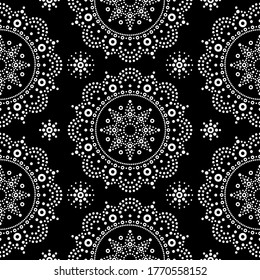 Aborigine dot painting mandala seamless vector pattern, white bohemian Mandala vector dot art on black background, retro folk design inspired by traditional art from Australia.