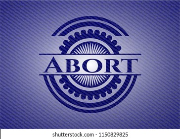 Abort badge with denim background