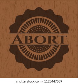 Abort badge with wood background