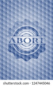 Abort blue badge with geometric pattern.