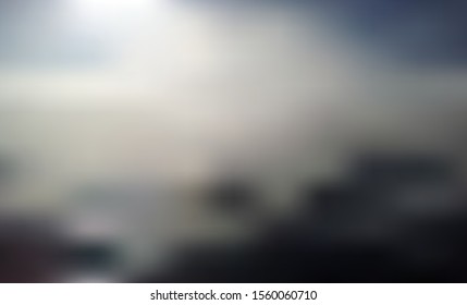 Above the Dark Clouds - Dreamy Blurred Vector Background. Sun, Sky and Black Clouds Horizon with Out-of-focus Effect. Gradient Mesh. Blurry Backdrop with Copy Space for Text.