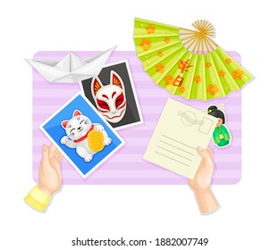 Above Table Layout with Human Hands Reading Postal Card with Chinese Attribute Vector Illustration