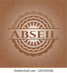 Abseil badge with wood background