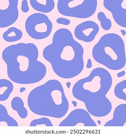 Abstract animal seamless pattern with irregular hand drawn blue shapes on a pink background. Vector simple spotted design