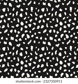 Abstract animal skin vector seamless pattern. Simple black and white texture with irregular brush spots, dots, strokes. Cute monochrome background. Wild leopard print. Minimal repeat geo design