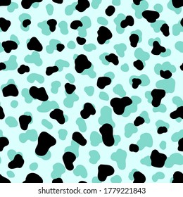 Abstract animal spotted skin seamless pattern. Mint green colored vector wallpaper.