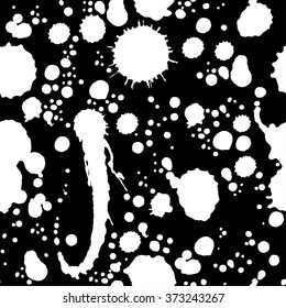 Abstract artistic paint splashes and blots seamless pattern. Black and white hand drawn splash texture. Vector illustration.