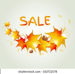 Abstract autumn background with orange maple leaves and acorn