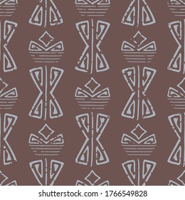 Abstract aztec seamless vector pattern background. Brown backdrop of light blue faded hand drawn shapes.With grunge texture for an aged look. Geometric ethnic repeat for environment friendly packaging
