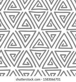 Abstract backdrop with gray hand drawn triangles on a white background. Seamless vector pattern.