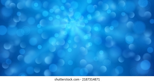 Abstract background in blue colors with diverging rays of light and small translucent circles with bokeh effect