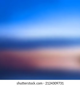 Abstract background in blue and purple colors. Blurred image of ocean shore, blue sky with clouds. Ideal for presenting your holiday or advertising design.