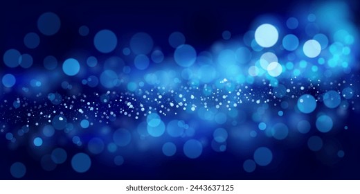 Abstract background in blue tones with many shiny sparkles, some of which are in focus and others are blurred, creating a captivating bokeh effect.