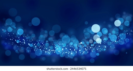 Abstract background in blue tones with many shiny sparkles, some of which are in focus and others are blurred, creating a captivating bokeh effect.