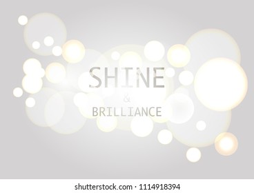 Abstract background with bokeh effect. Blurred defocused lights in white and grey colors
