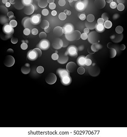 Abstract background with bokeh effect. Blurred defocused lights in white colors