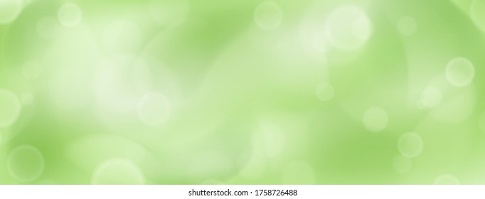 Abstract background with bokeh effects in green colors