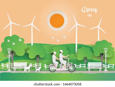 Abstract background card with Couple Travelling by bicycle on the grass in the morning in the Green city,Exercise makes healthy,paper craft vector and illustration.