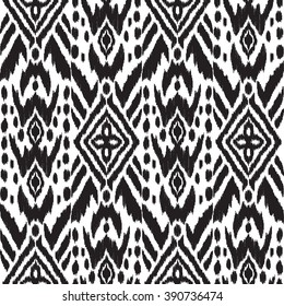 Abstract background in the ethnic style. Black and white Ikat seamless pattern for textile, wallpaper, card or wrapping paper.