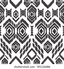 Abstract background in the ethnic style. Black and white Ikat seamless pattern for textile, wallpaper, card or wrapping paper.