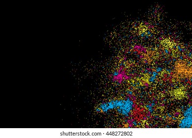 Abstract background, falling confetti. Many random tiny glitter pieces. Golden, red, blue and violet glitter Christmas random blow patterns. Abstract sparkle glittering background. Holiday texture. 