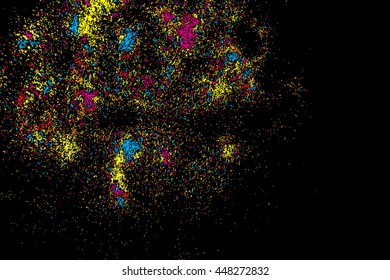 Abstract background, falling confetti. Many random tiny glitter pieces. Golden, red, blue and violet glitter Christmas random blow patterns. Abstract sparkle glittering background. Holiday texture. 